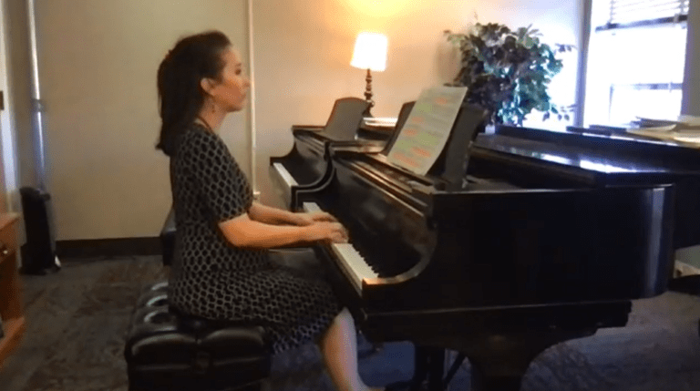 Lynn Worcester Jones plays a grand piano