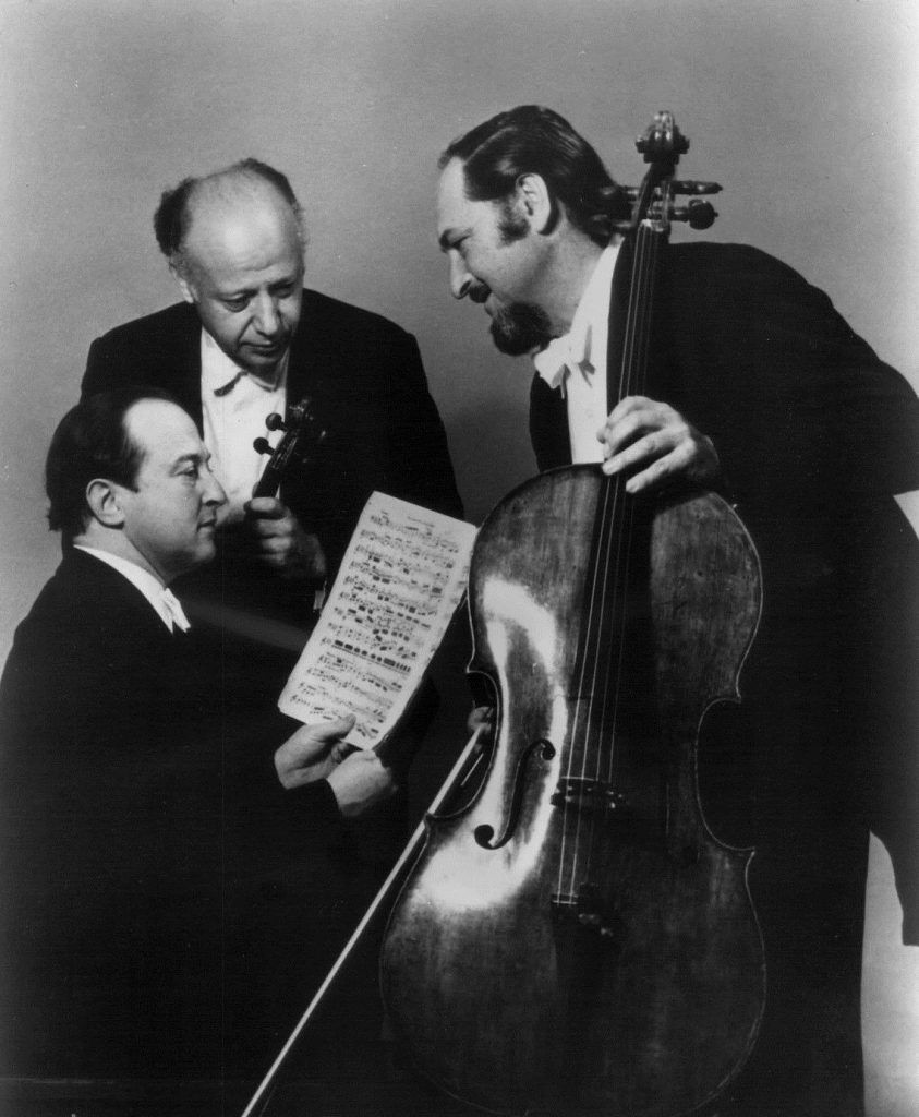 Members of the Beaux Arts Trio Isidore Cohen and Bernard Greenhouse gather around pianist Menahem Pressler.